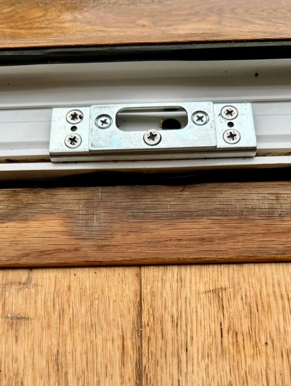 A new lock keep plate fitted to a timber door frame after a lock failure